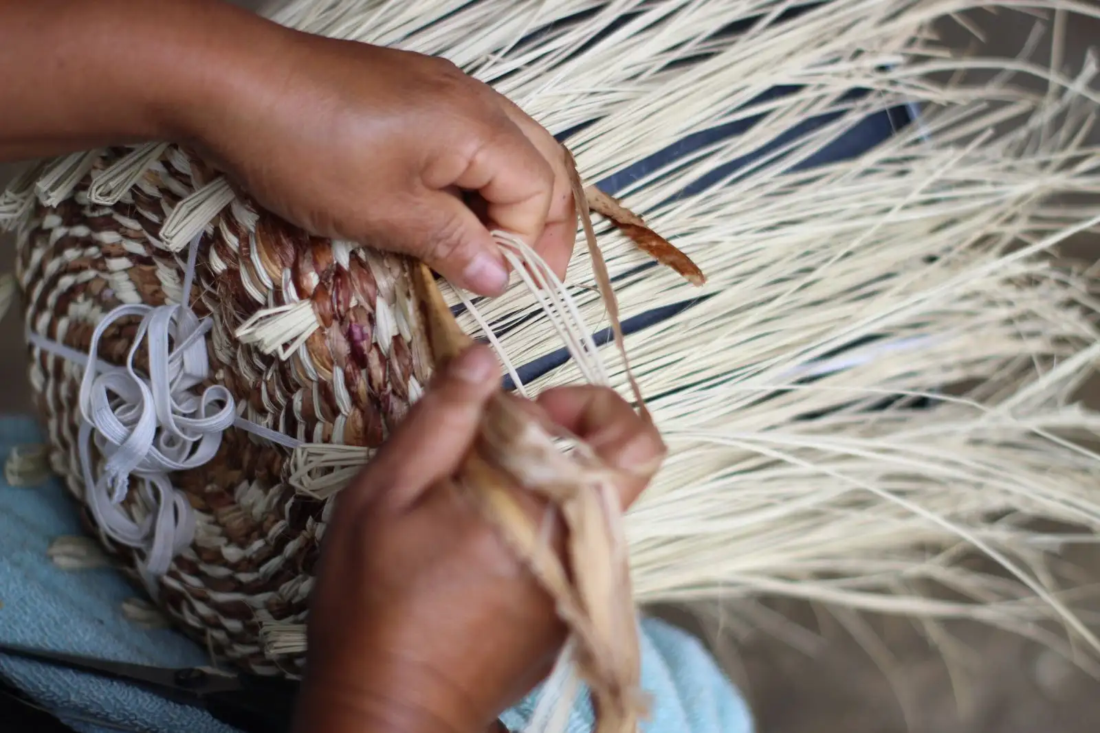 Artisan hands weaving natural fique fiber